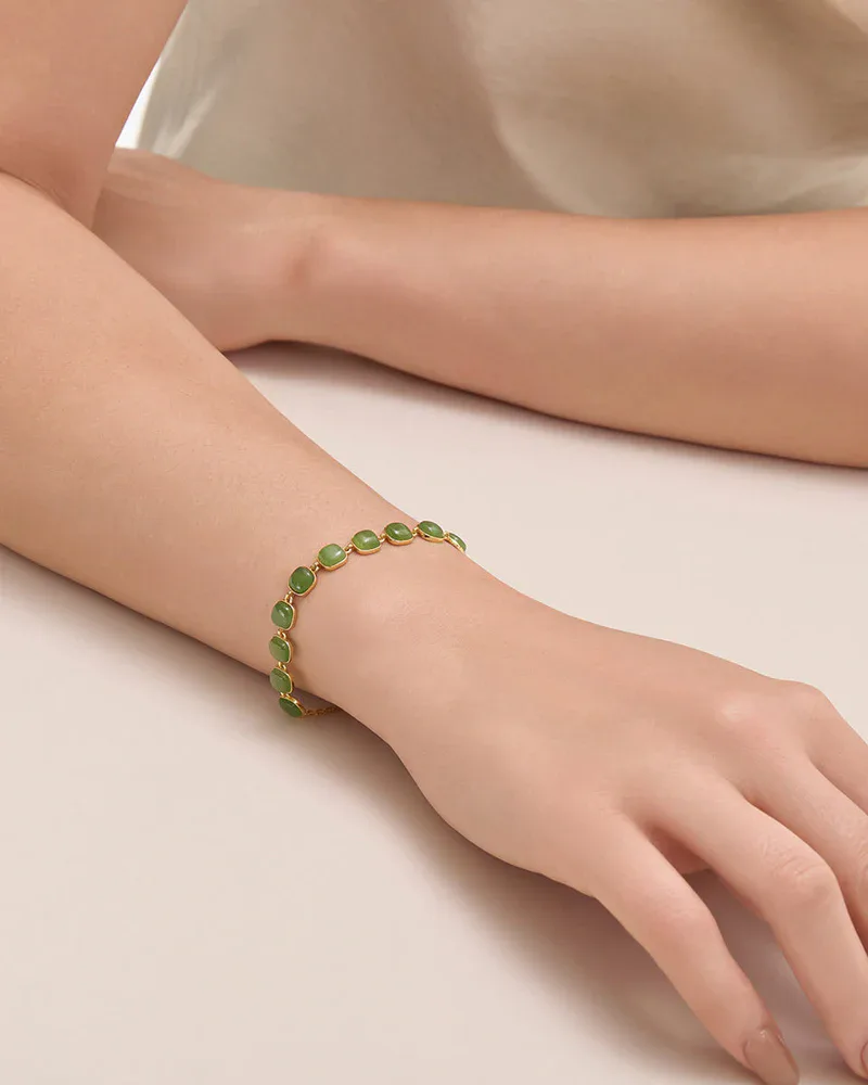 Close-up of the StillWater green jade bracelet worn on the wrist