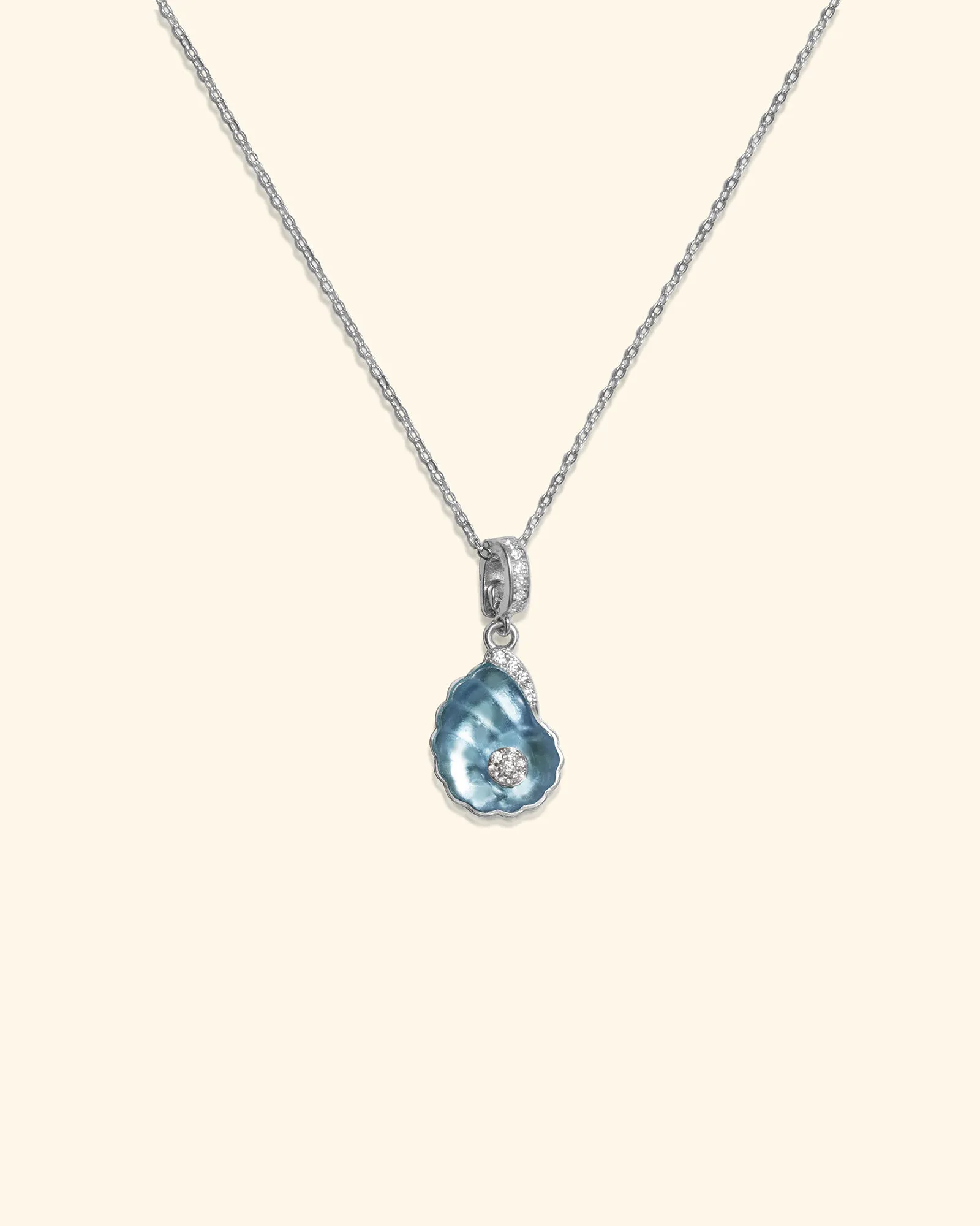 LUCE Pure sterling silver shell necklace with light blue crystal