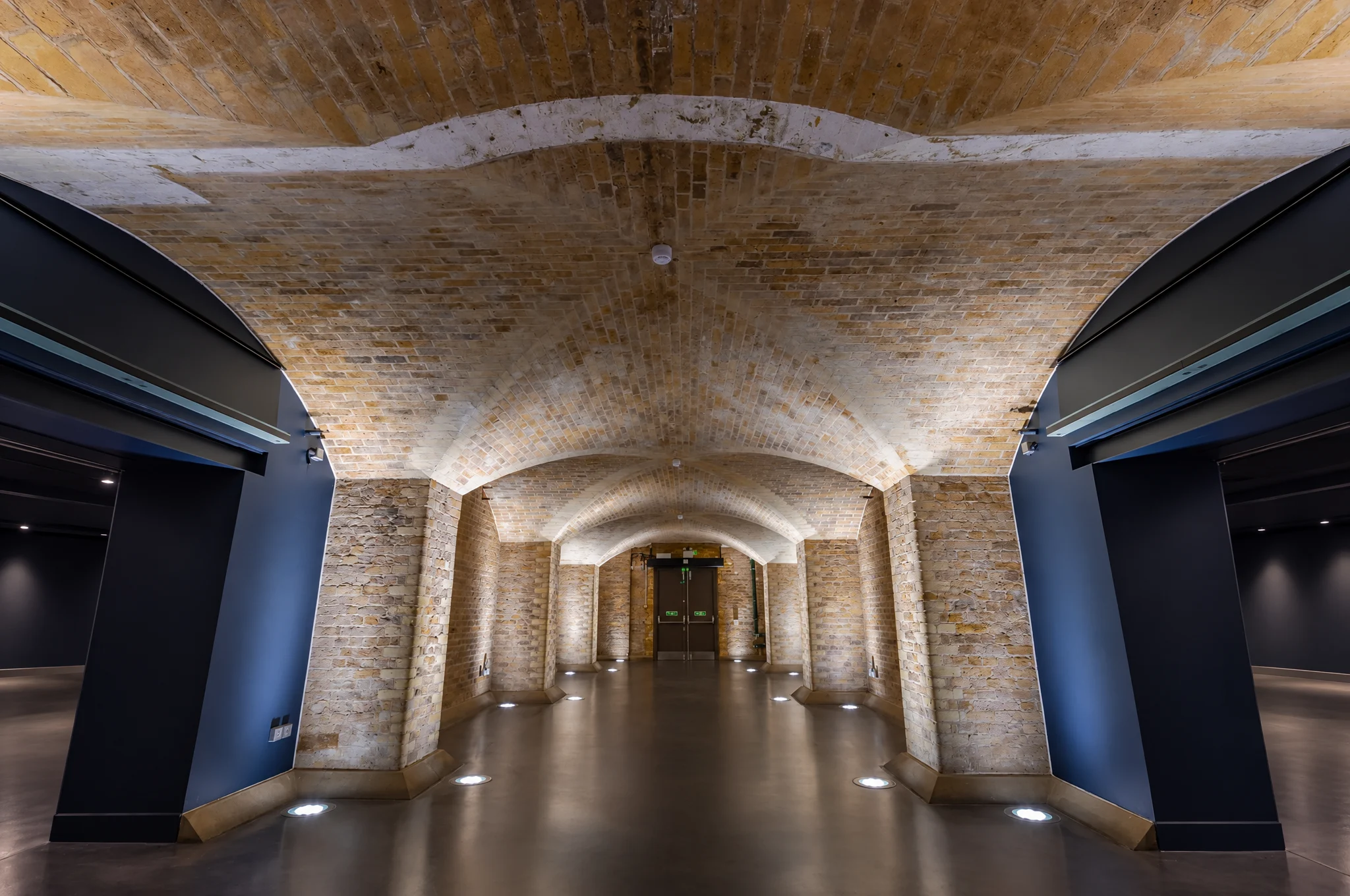 Vaulted brick corridor at SPYSCAPE London in Covent Garden