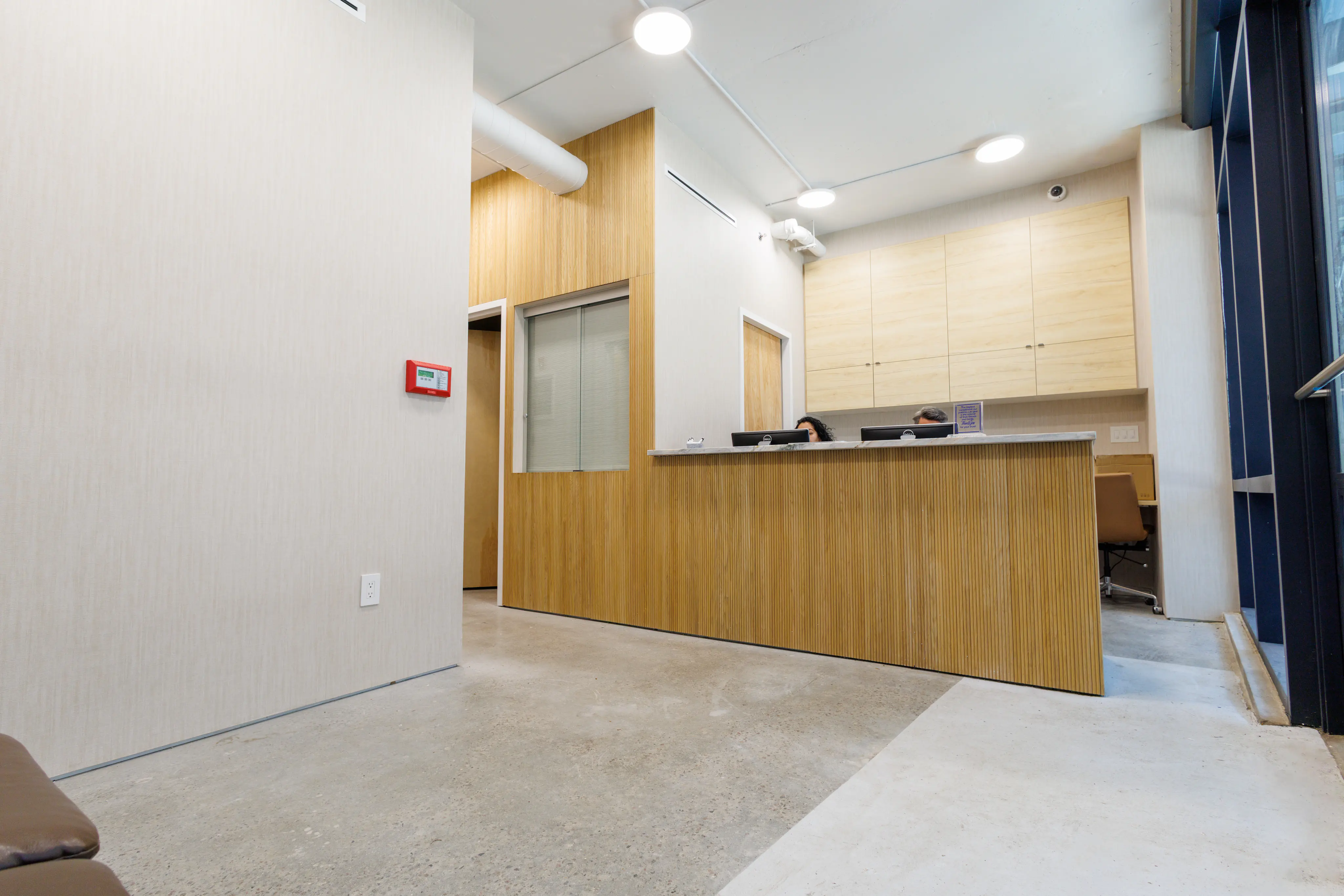 Wood reception desk inside the Lower East Side office