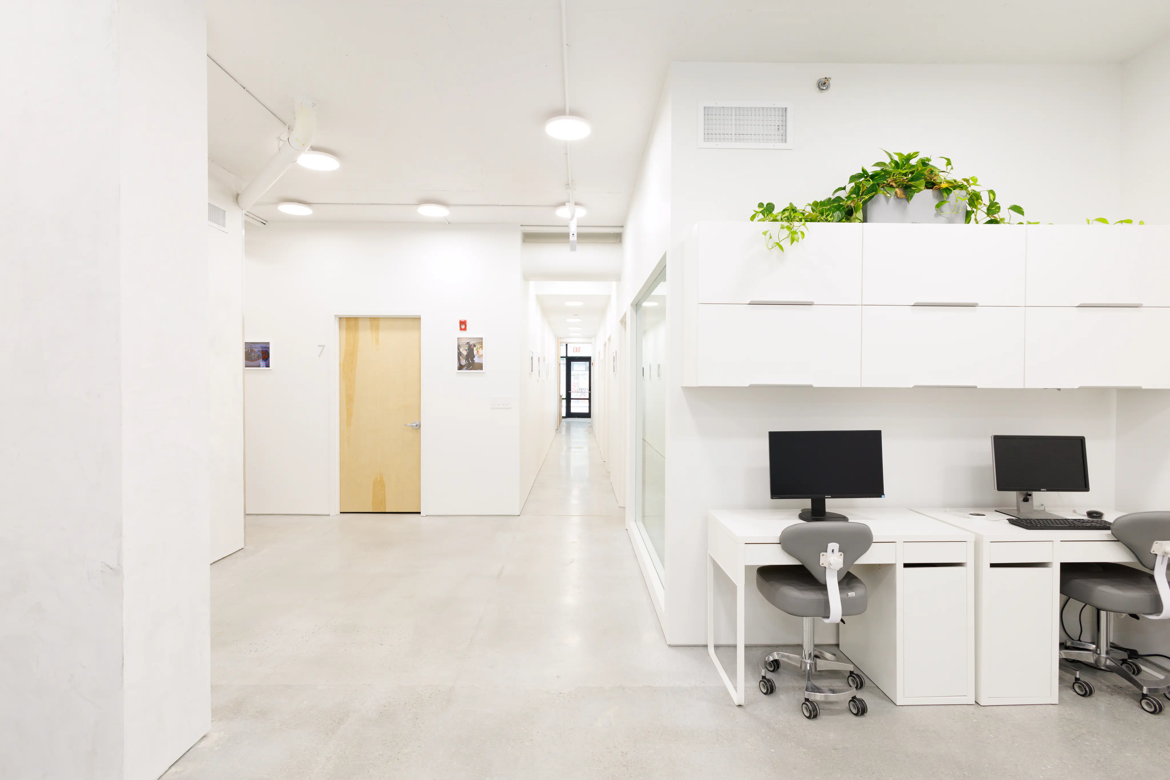 Bright hallway and work area inside the Lower East Side office