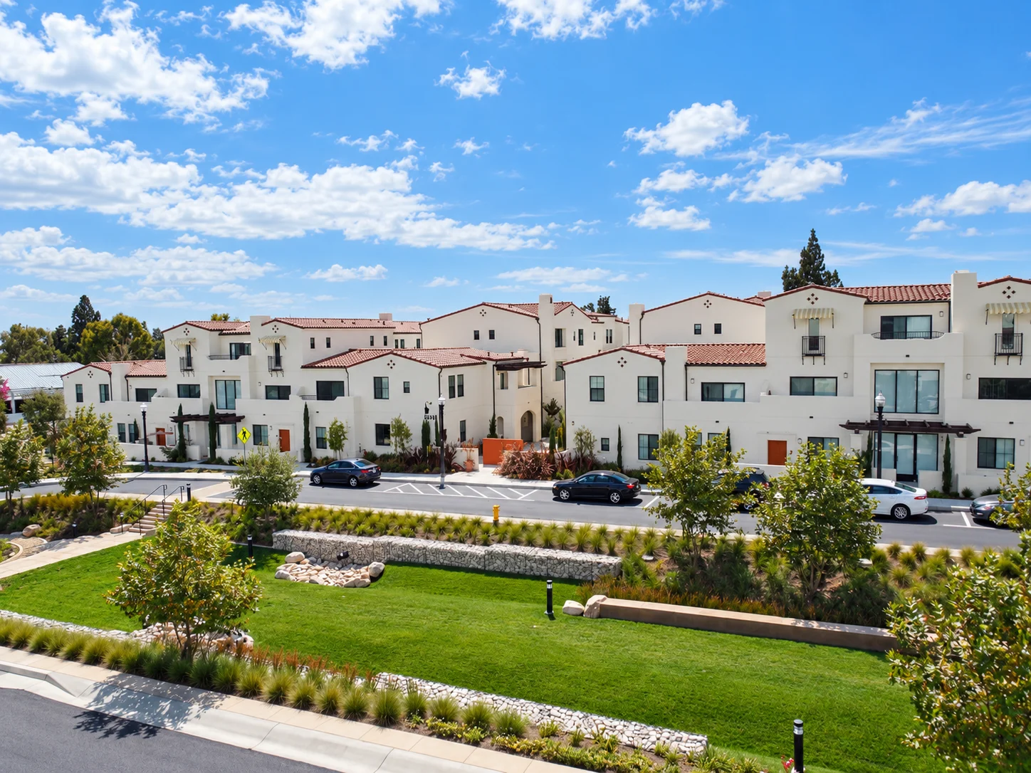 Buildings and landscaped pedestrian path at Paseos at Montclair North