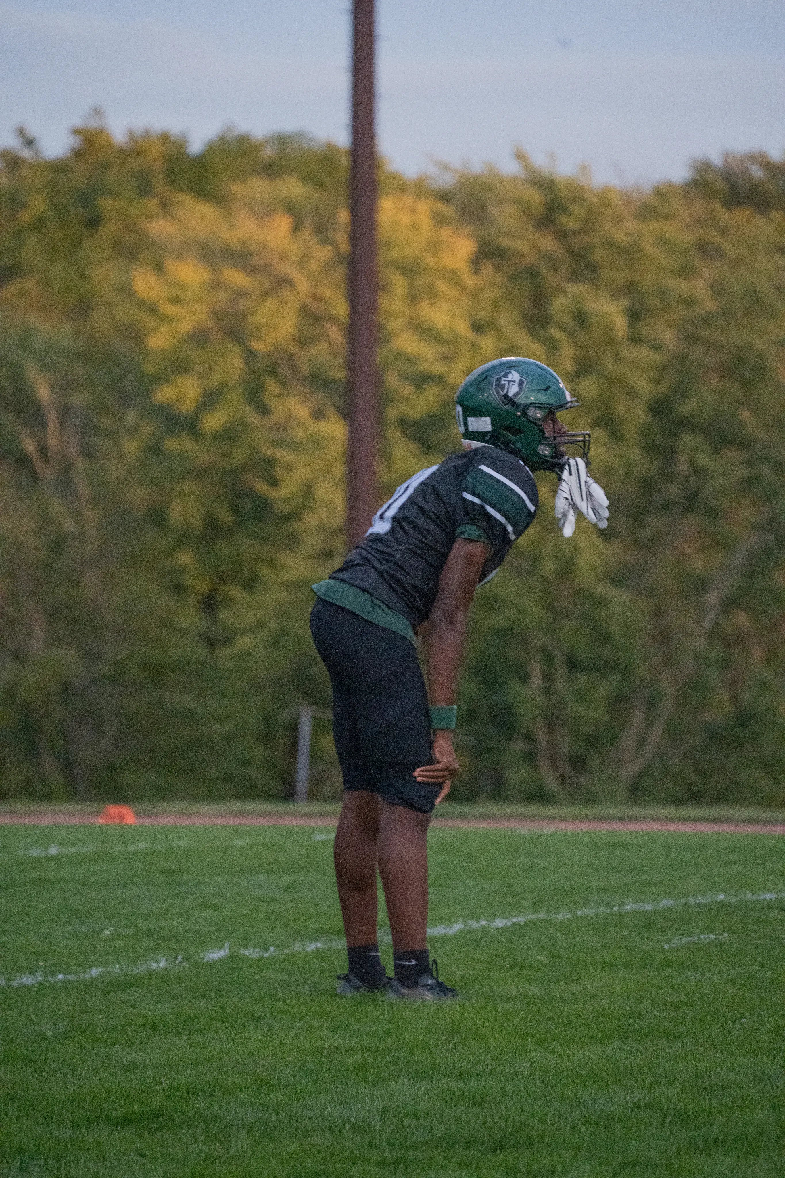 Football player in a ready stance on the field