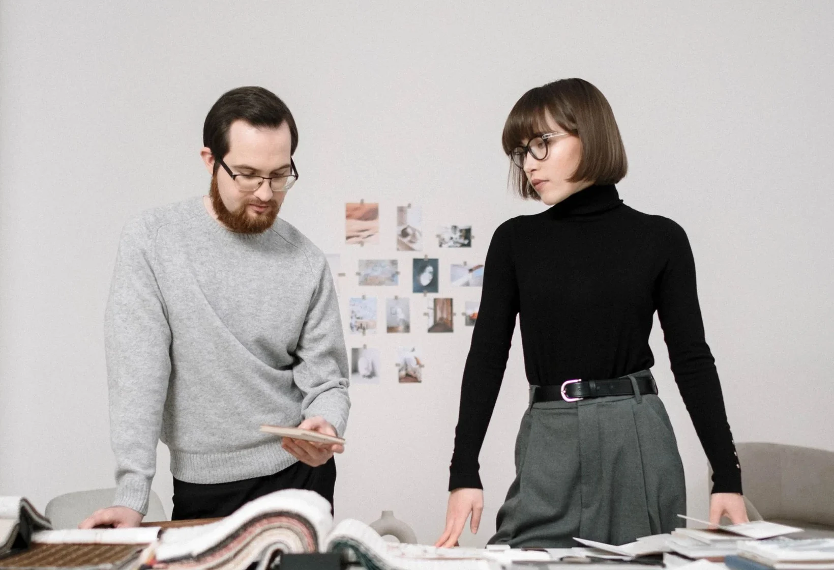 Stock photo of two designers reviewing material samples in a design office.