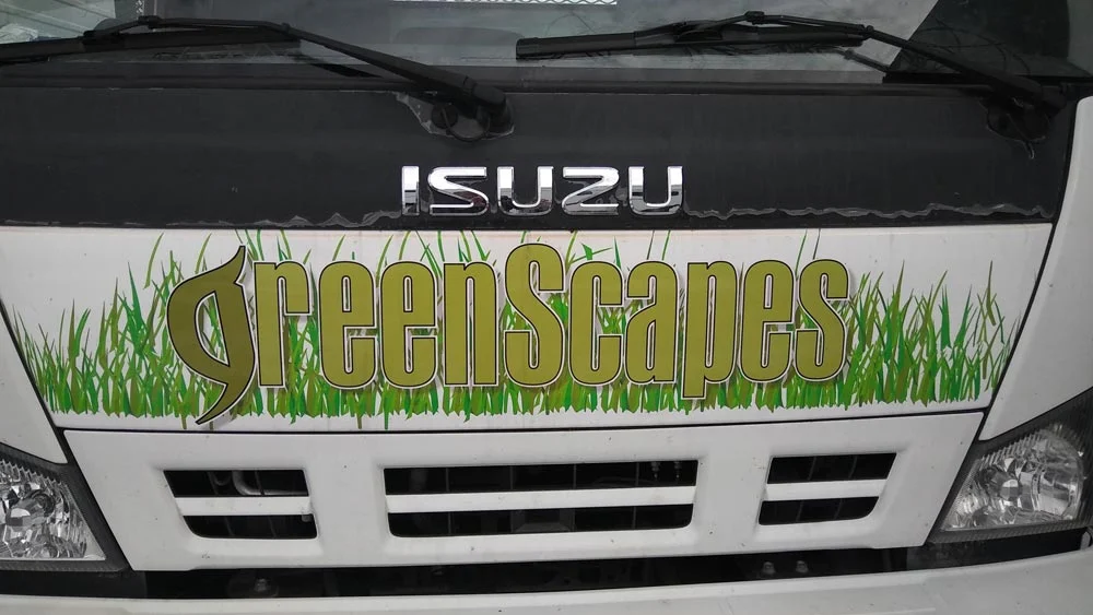 GreenScapes logo on the front of the company truck