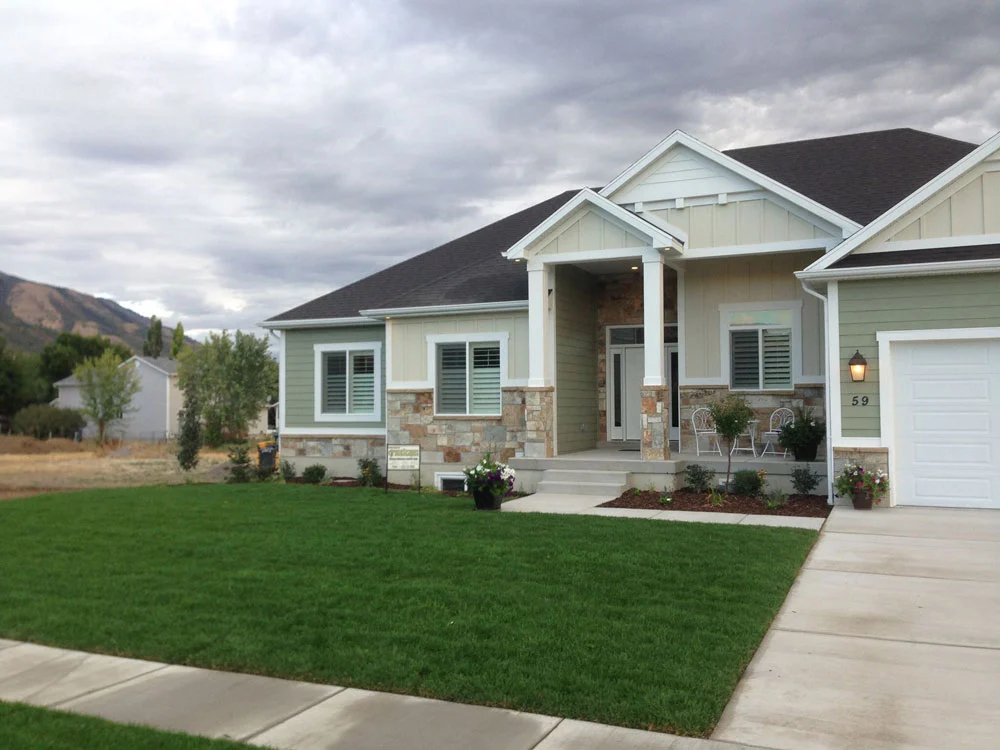 Finished green front lawn and landscaping at a new home in Cache Valley