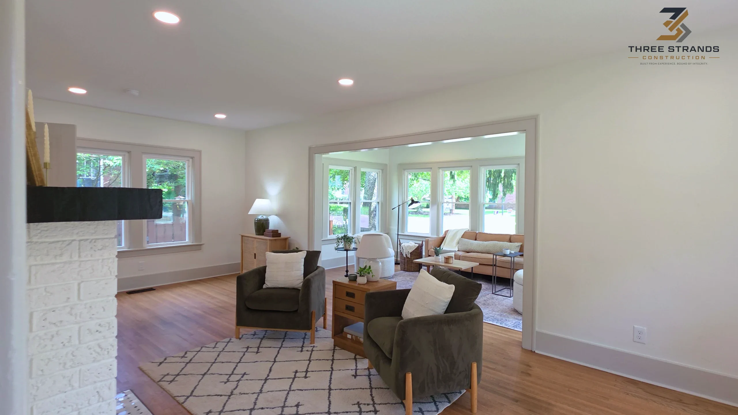 Living room from the Inkster whole-house renovation, with seating and natural light