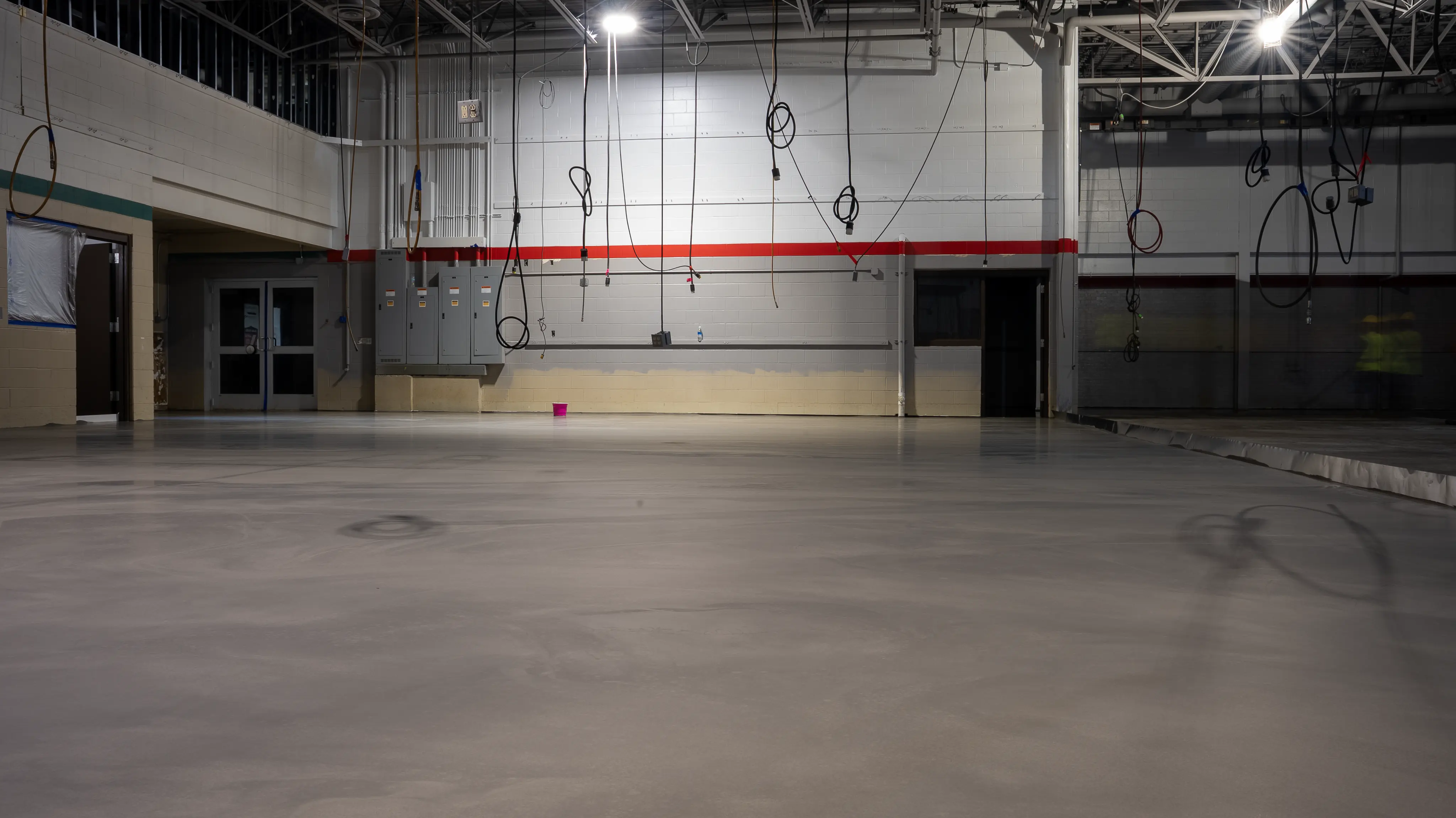 Prepared concrete floor inside a large institutional building