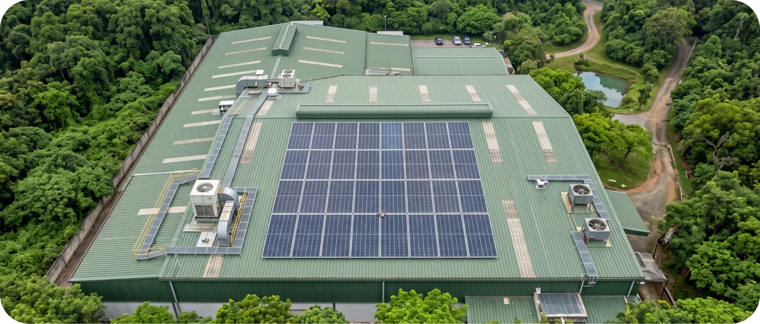 Aerial view of a green industrial facility with rooftop solar