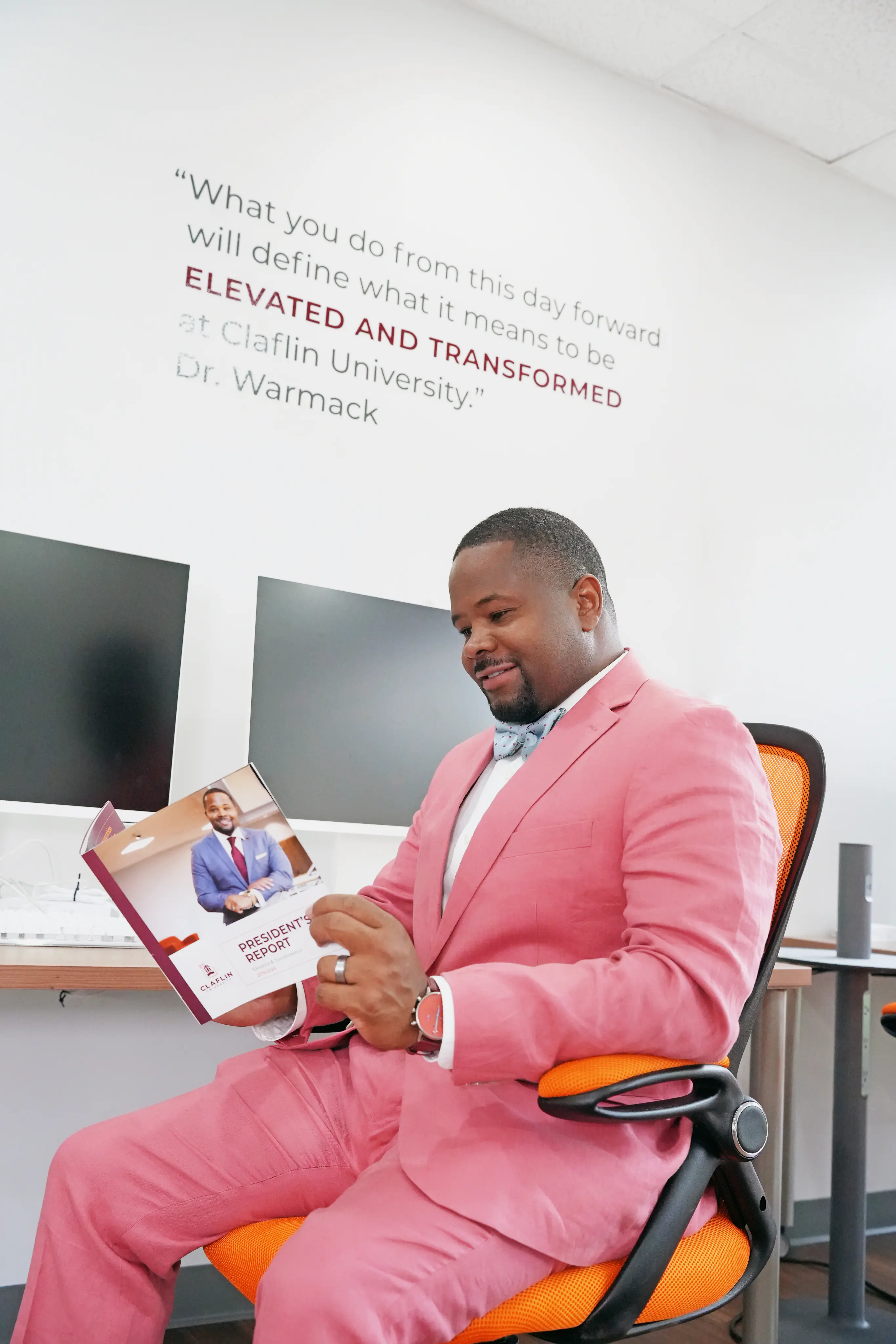 Dr. Warmack reading the Claflin President's Report in his office