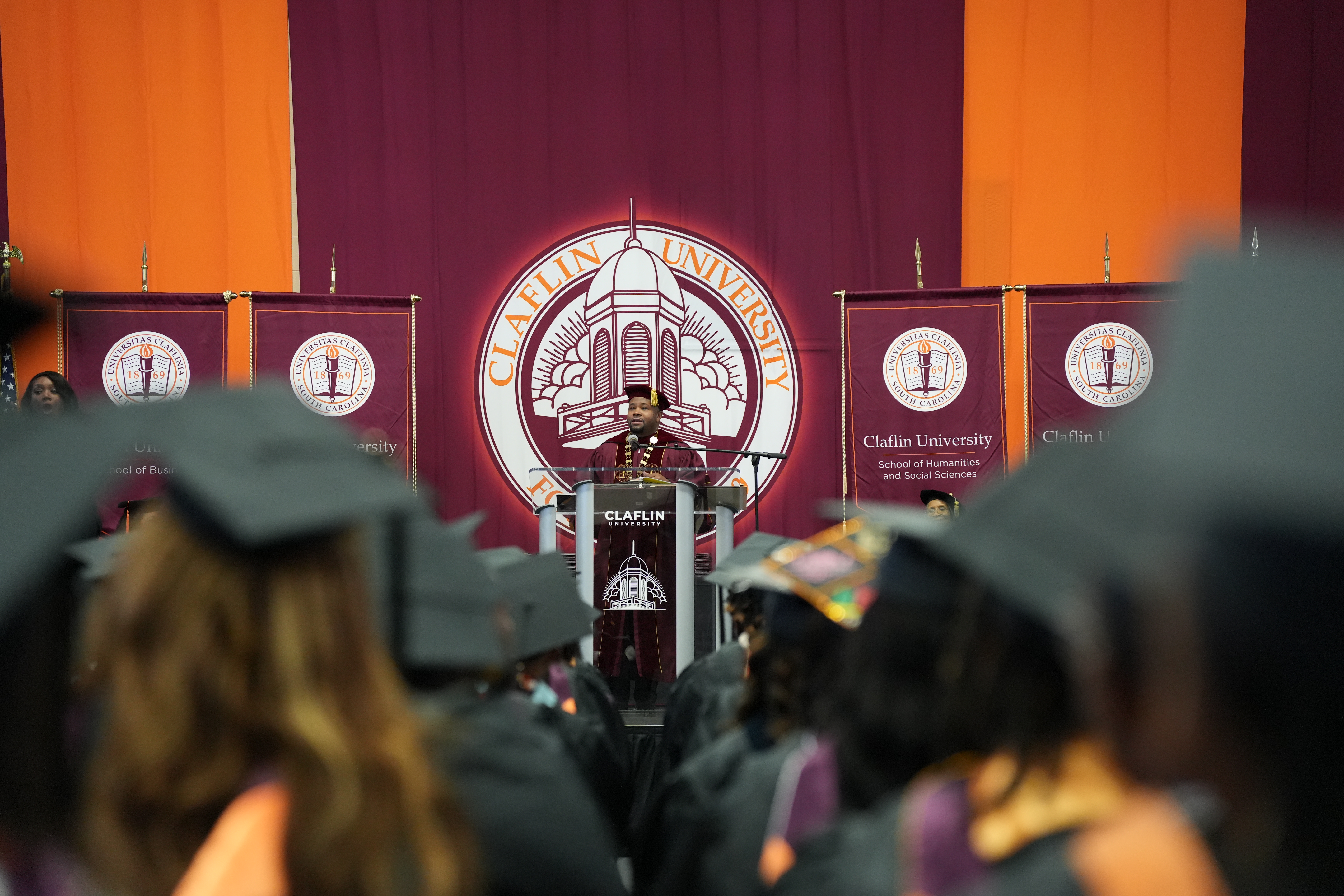 A speaker addressing Claflin graduates at commencement