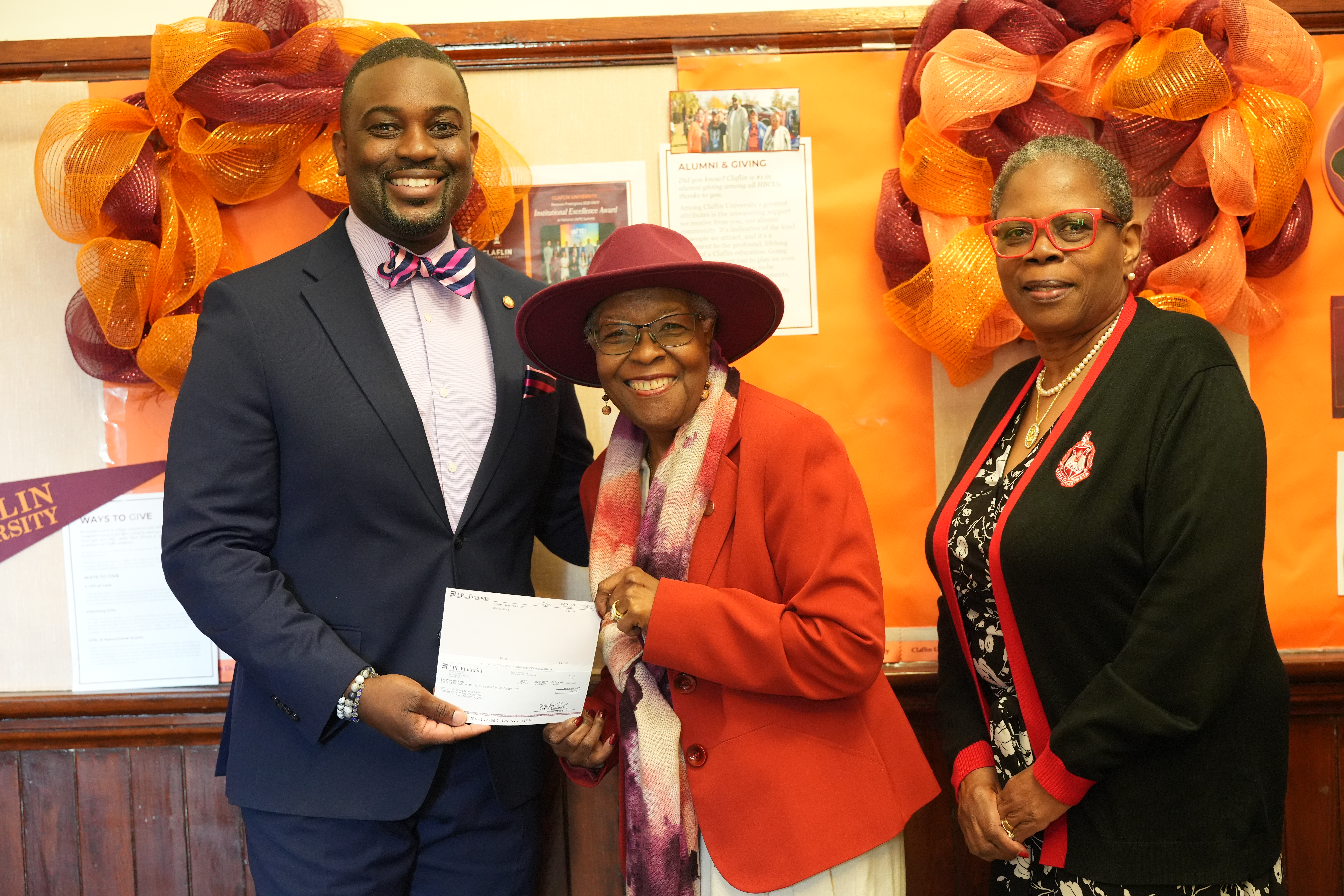 Claflin supporters presenting a gift check