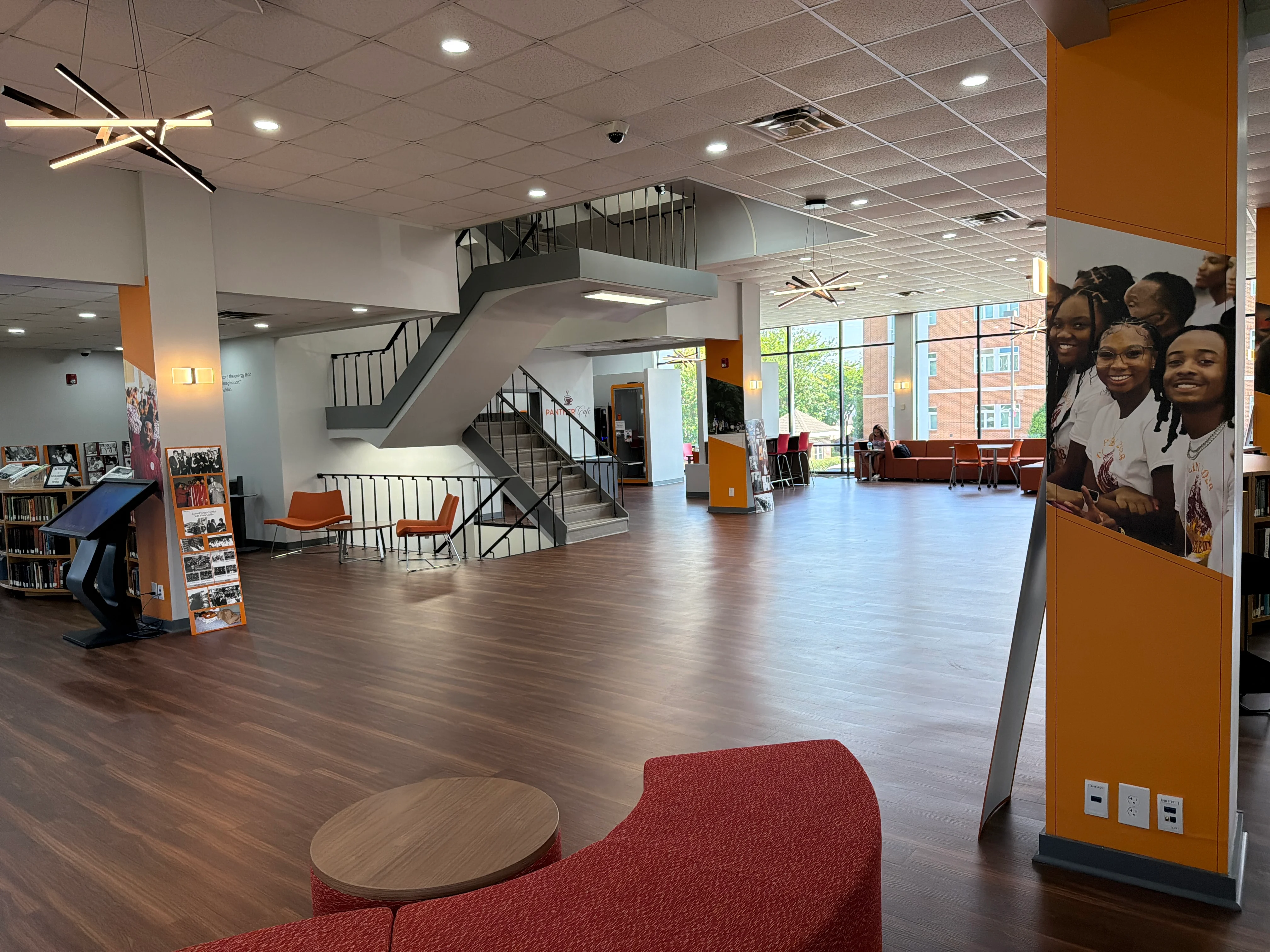 Central staircase, seating, and study areas inside the H.V. Manning Library