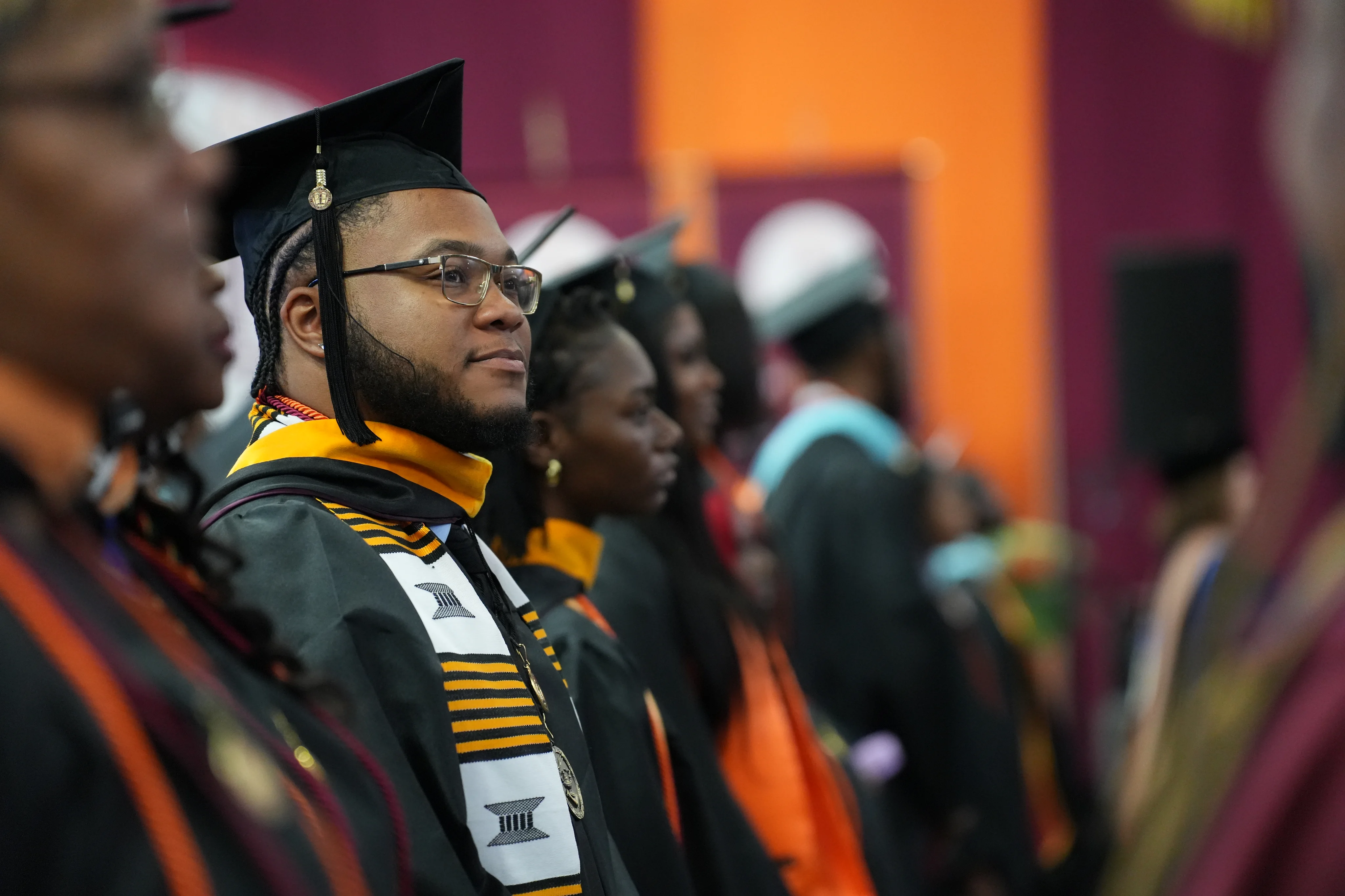 Claflin graduates in caps and kente stoles at commencement