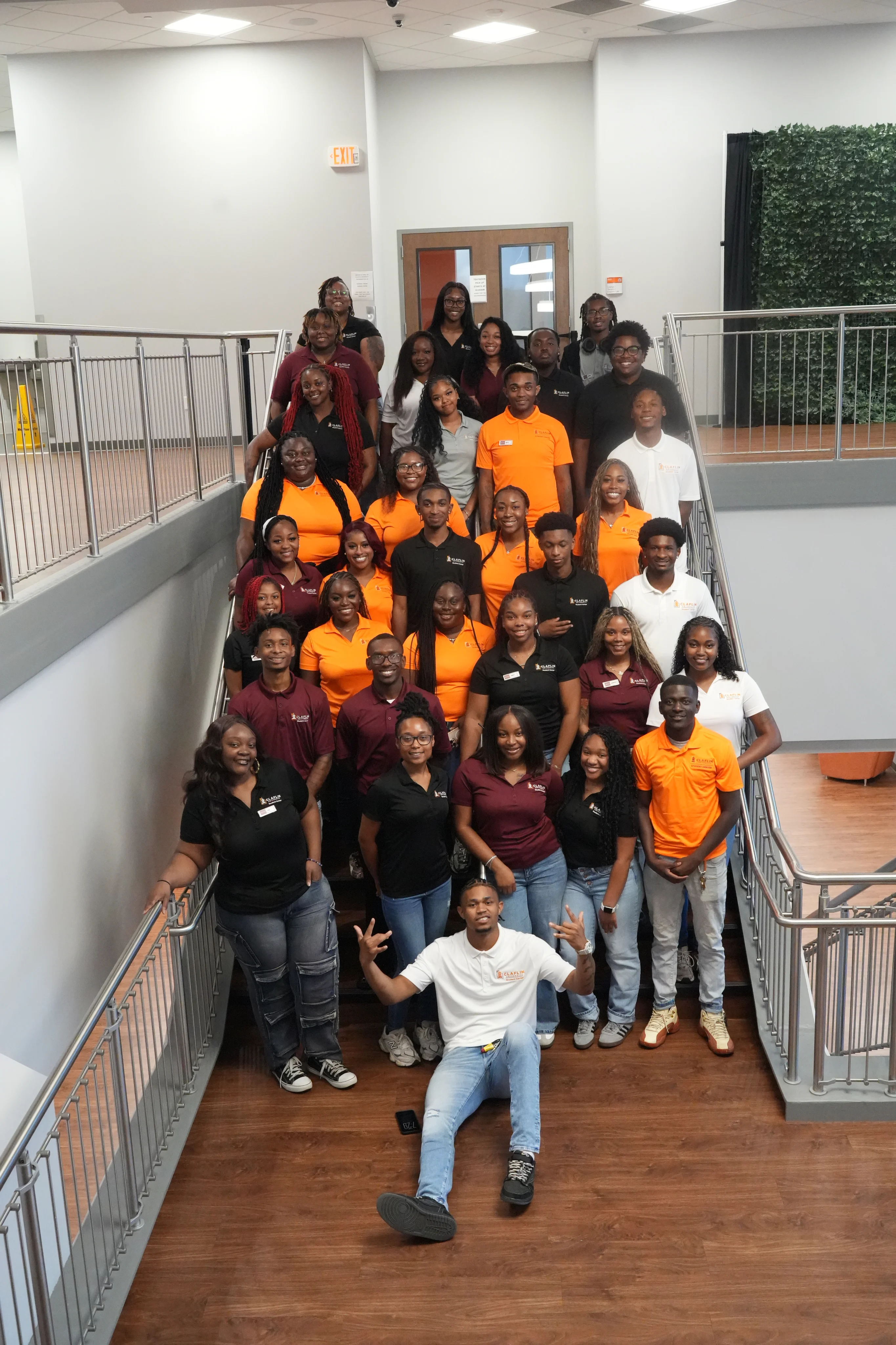 Claflin University Student Center student staff gathered on the center staircase