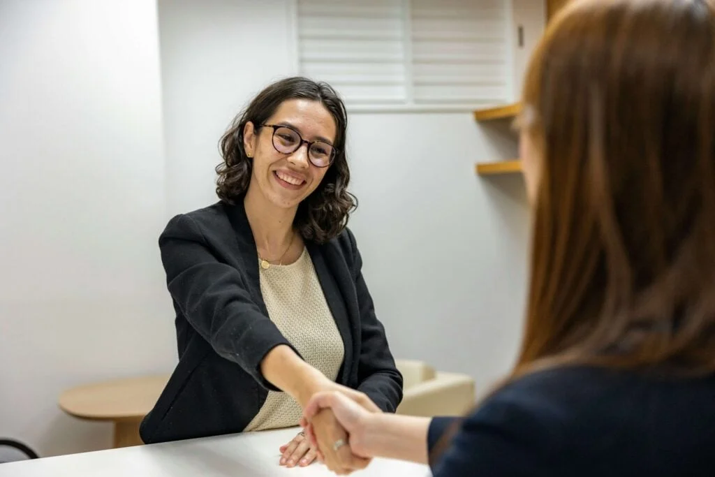 Two people shaking hands — Sengo's recruitment process is built on transparency and respect