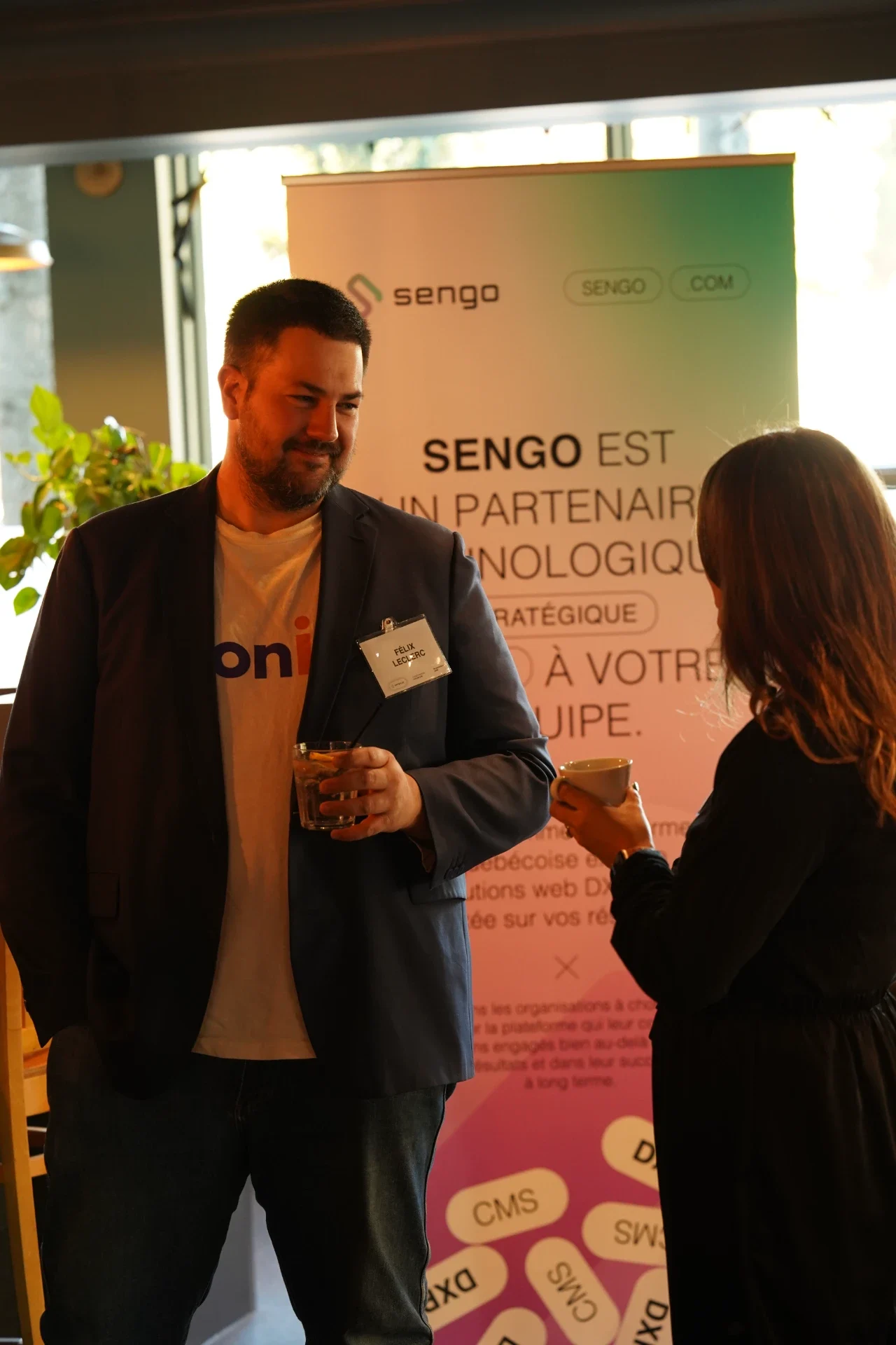 Conversation in front of the Sengo banner