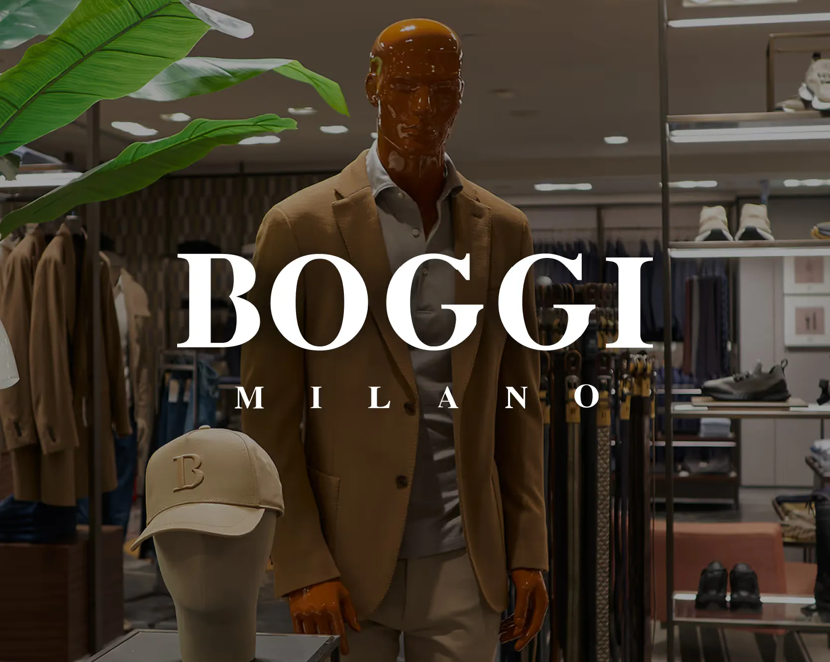 Boggi Milano store with a tailored camel jacket on a mannequin and the Boggi Milano wordmark