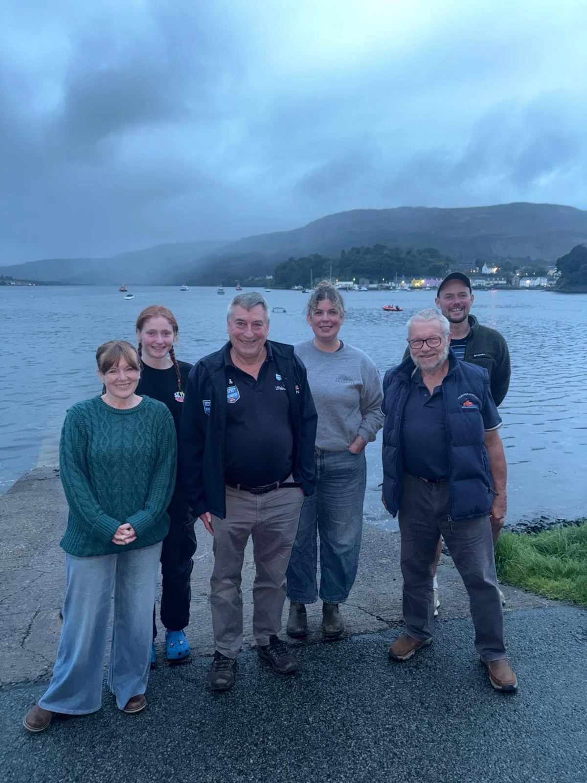 Portree Sauna staff and regular users with RNLI water safety representatives at Skye Sailing Club