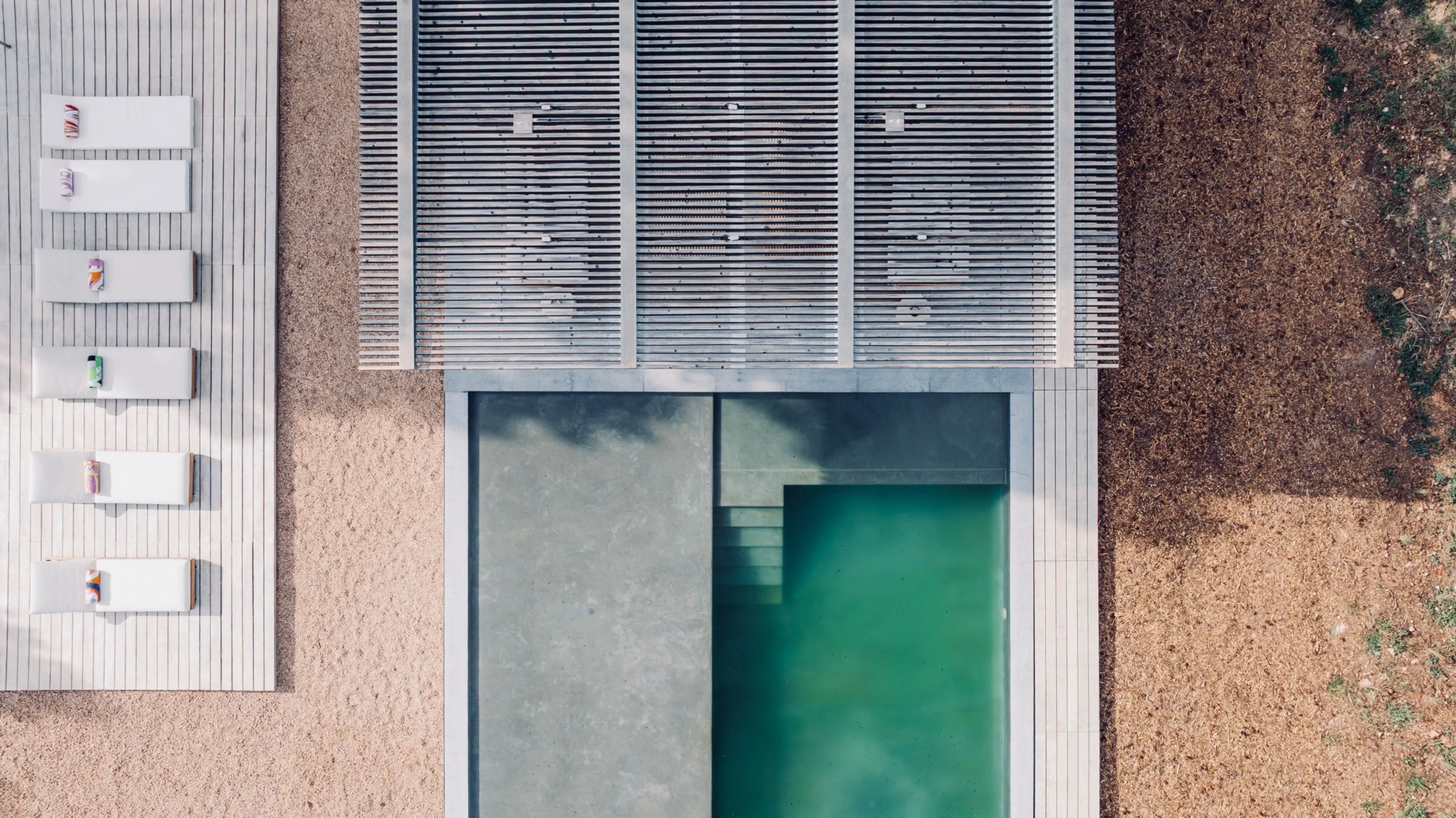 Overhead view of the house roof and swimming pool