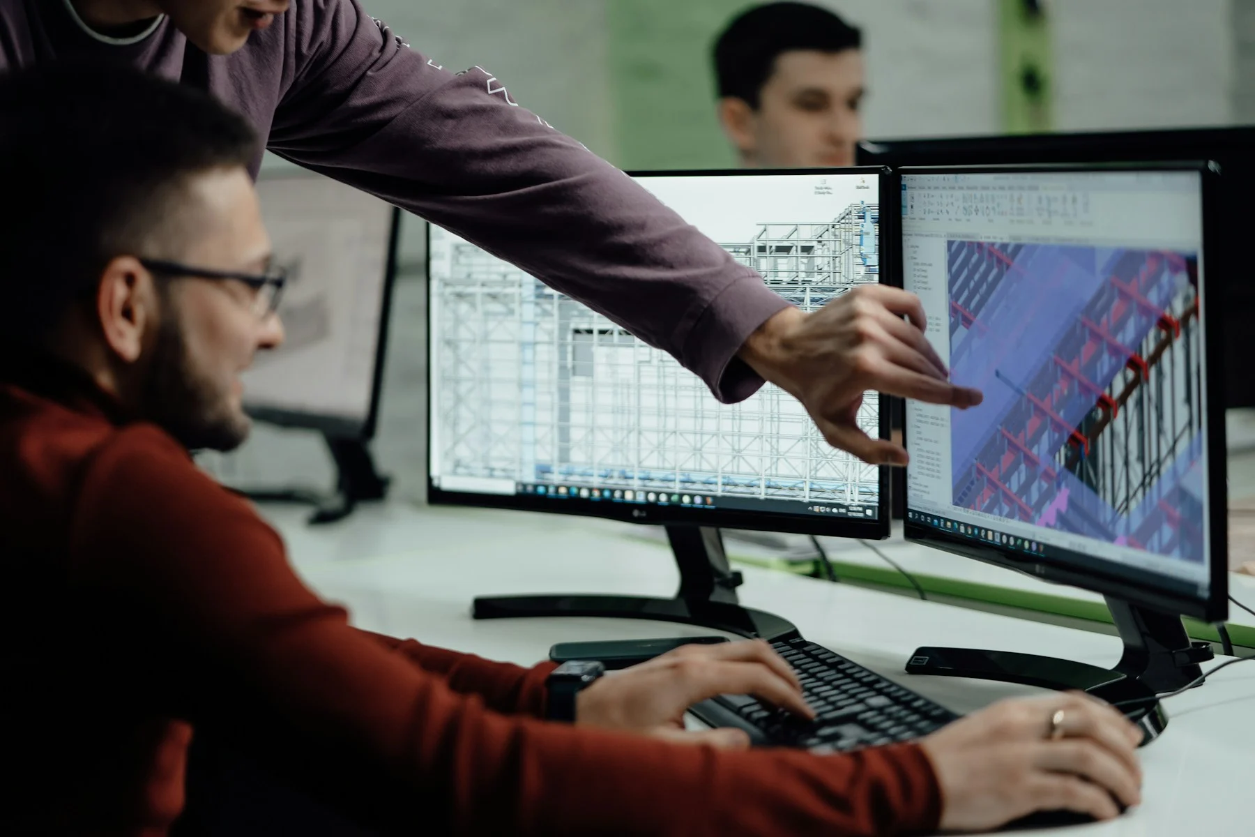 Planning professionals reviewing digital architectural designs together