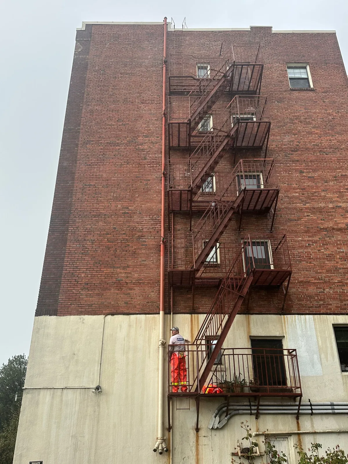 Brick building and fire escape after graffiti removal