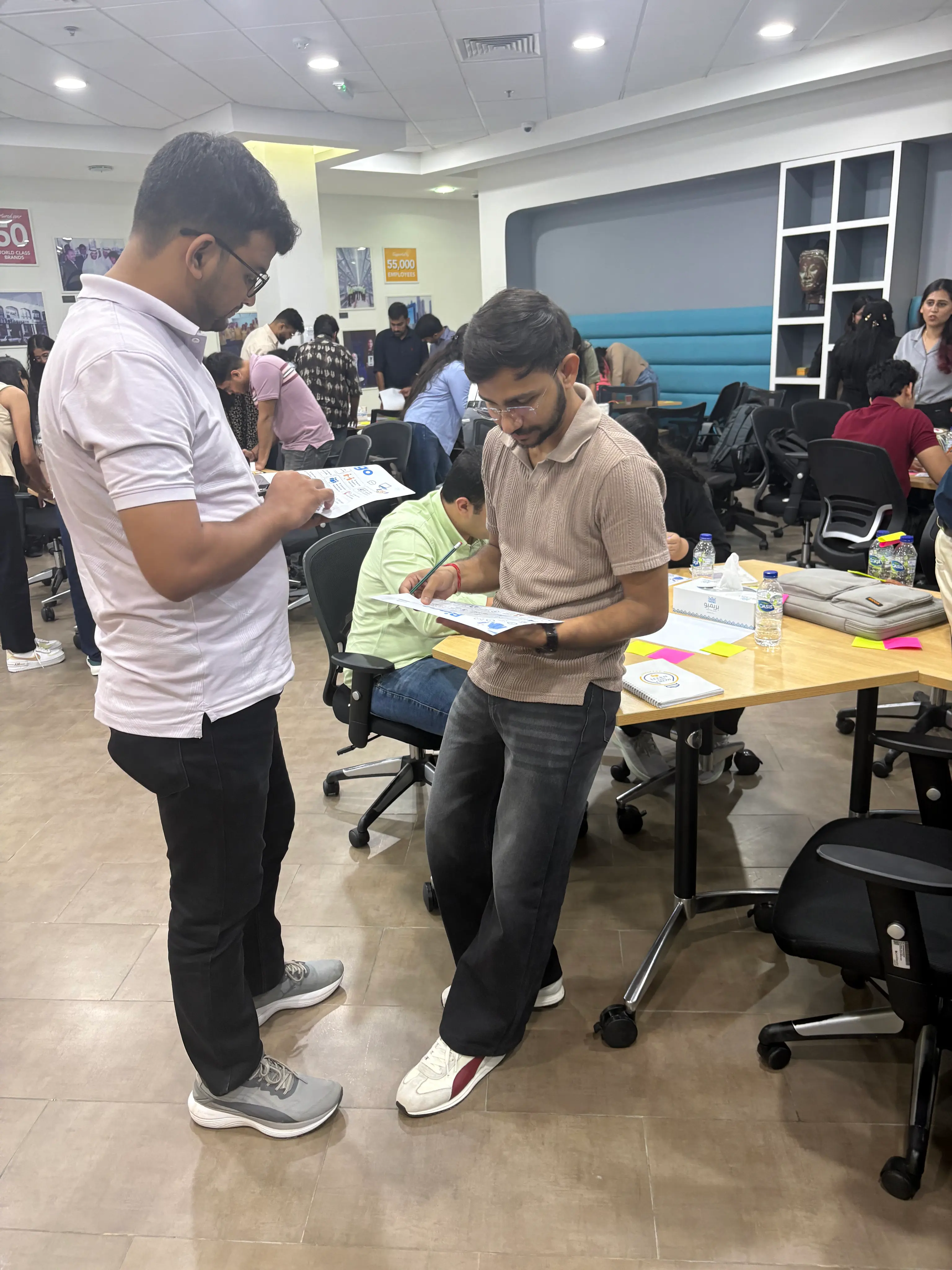 Colleagues applying behavioural skills in a workplace workshop