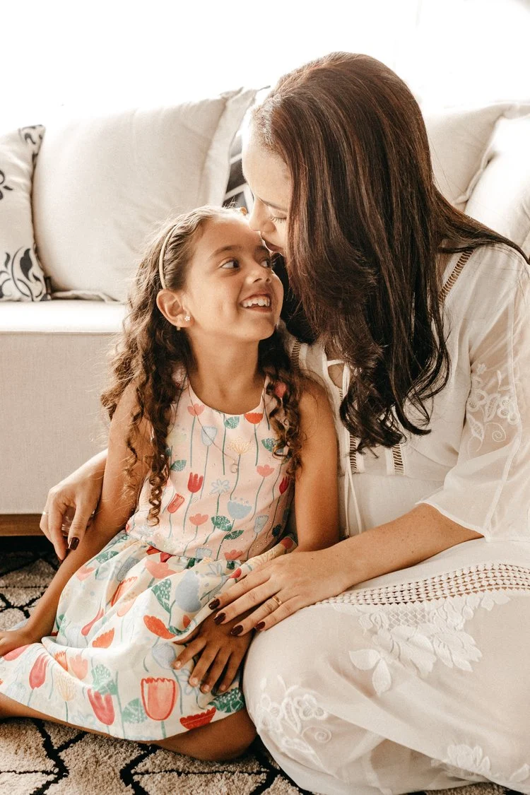 A mother and daughter sharing a moment at home