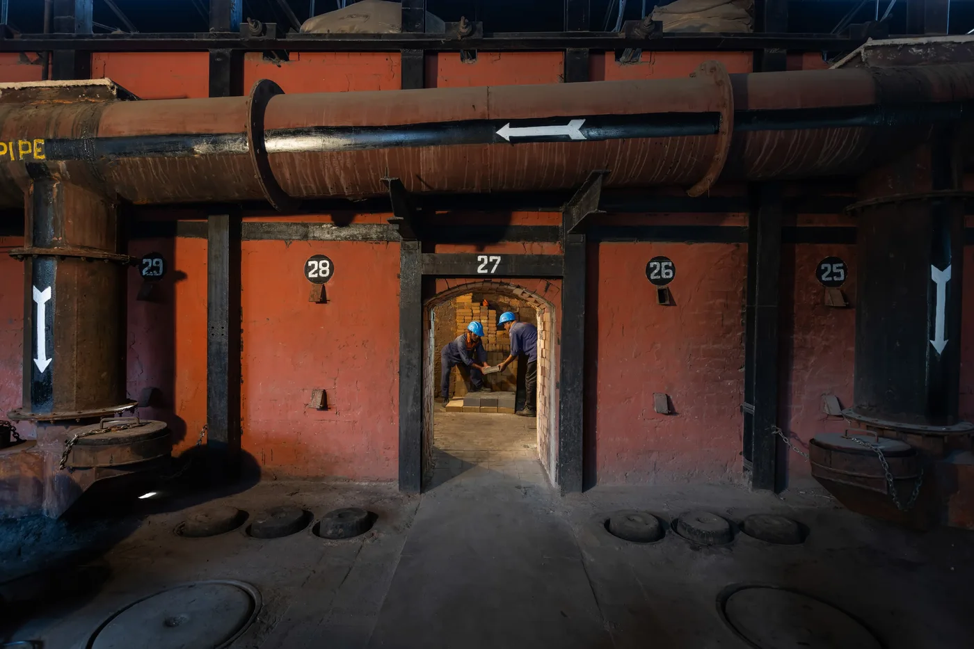VRL team working with refractory bricks inside the kiln