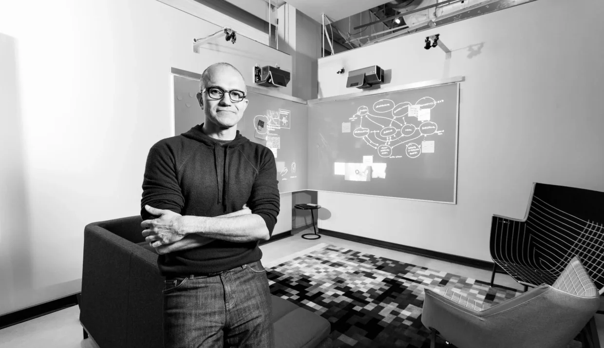 Satya Nadella standing in a workspace