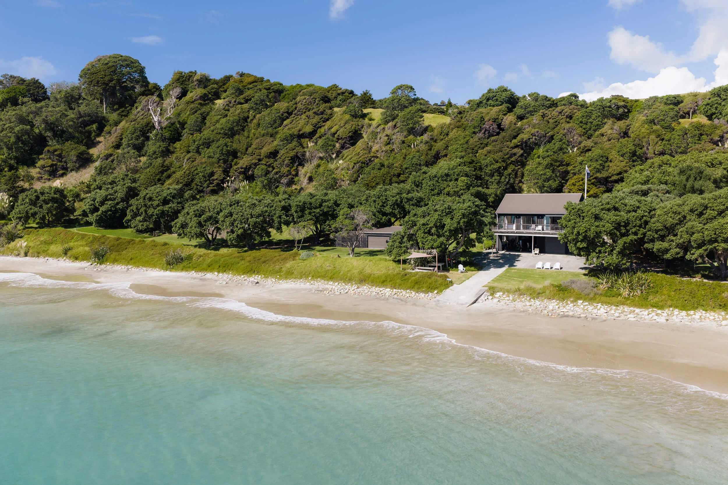 The Boatshed and boat ramp on the beachfront at Andersons Cove