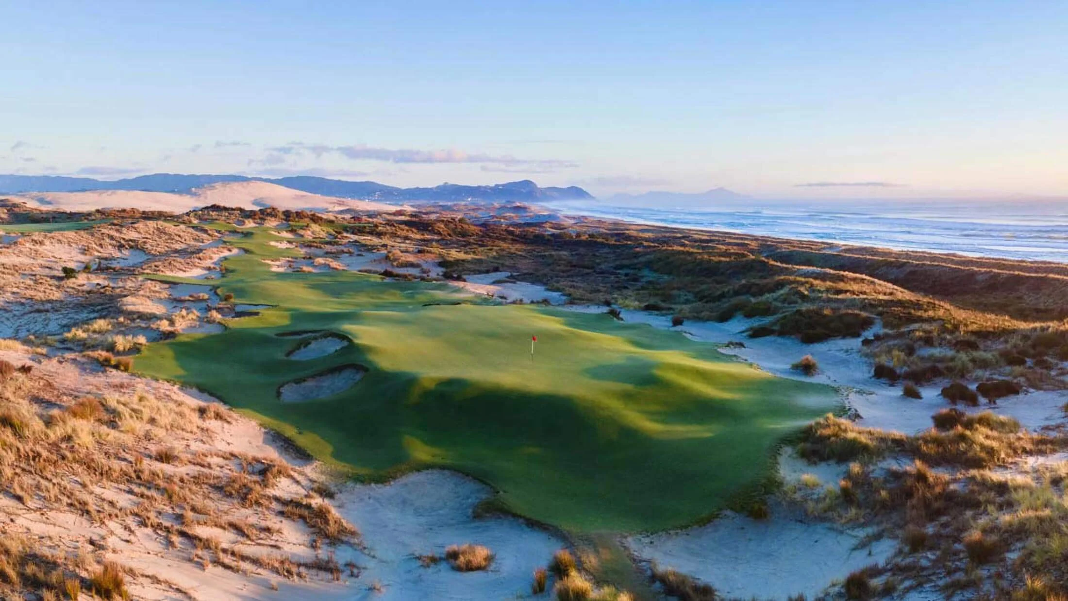 Golf green among sand dunes at Tara Iti Golf Club