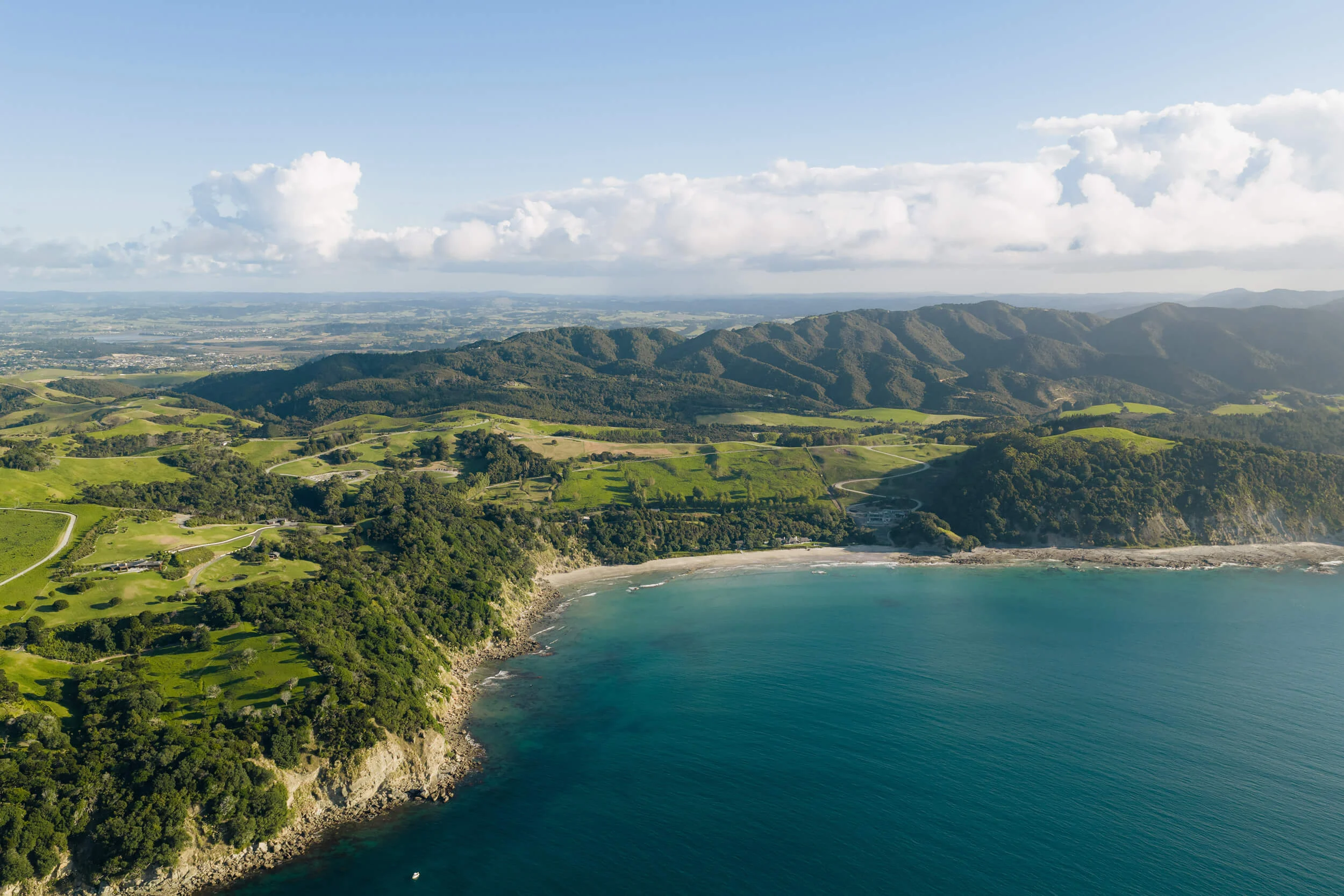 Aerial view of the grounds and coastline at Andersons Cove