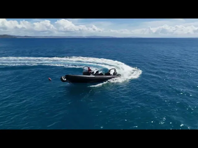 A boat on the clear blue waters off Andersons Cove