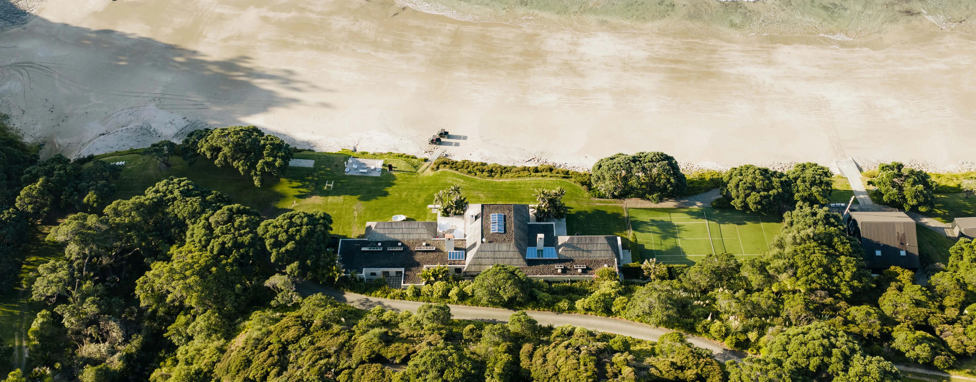Aerial view of the main residence and beachfront gardens