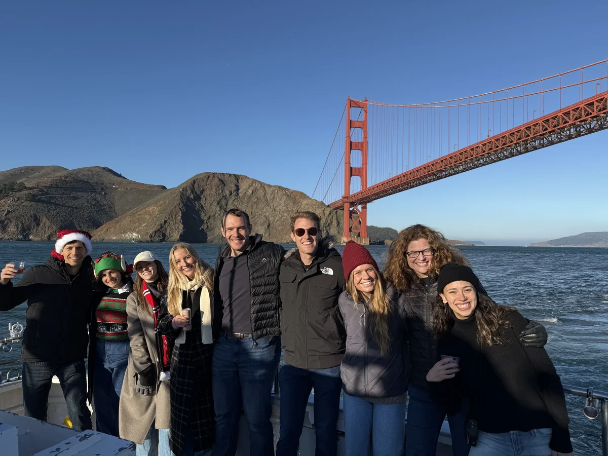 Team members together near the Golden Gate Bridge
