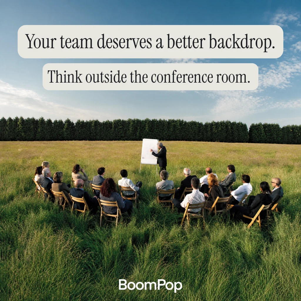 BoomPop campaign creative showing a team meeting outdoors with the line 'Your team deserves a better backdrop' and the BoomPop wordmark