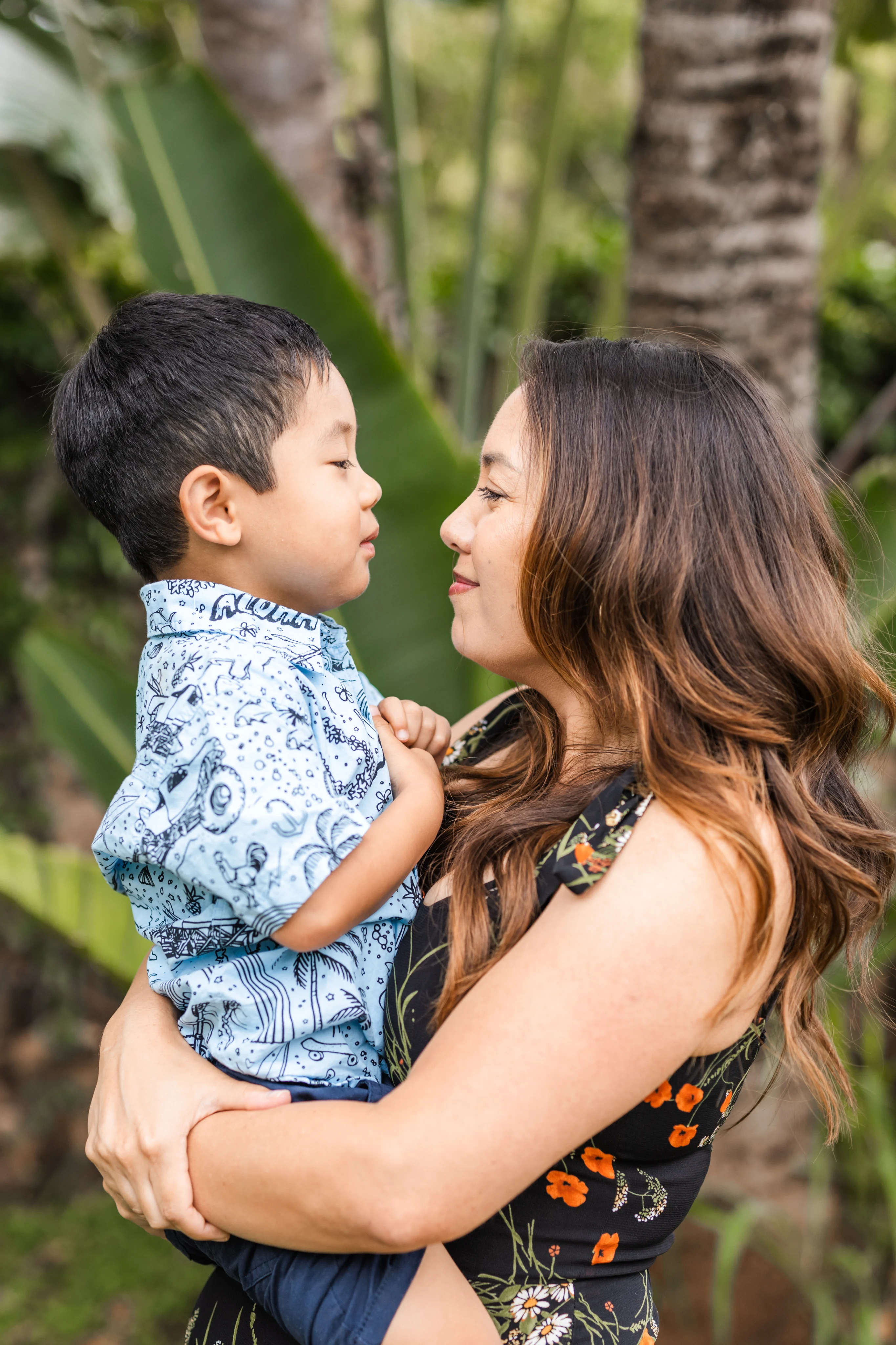 The Maui Unpacked founder holding her son outdoors