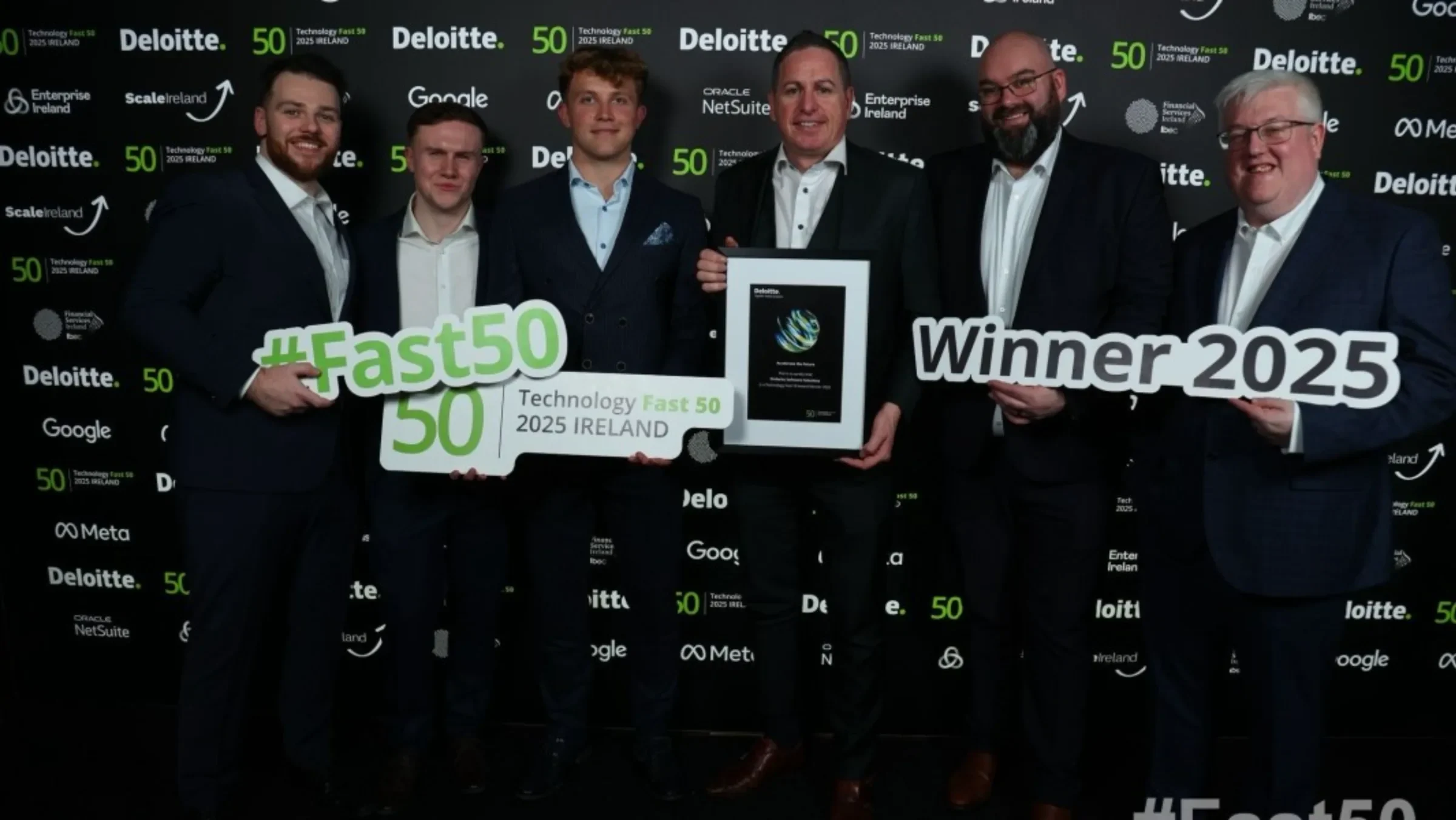 The Ordorite team holding Deloitte Technology Fast 50 2025 Ireland winner signs and the award certificate
