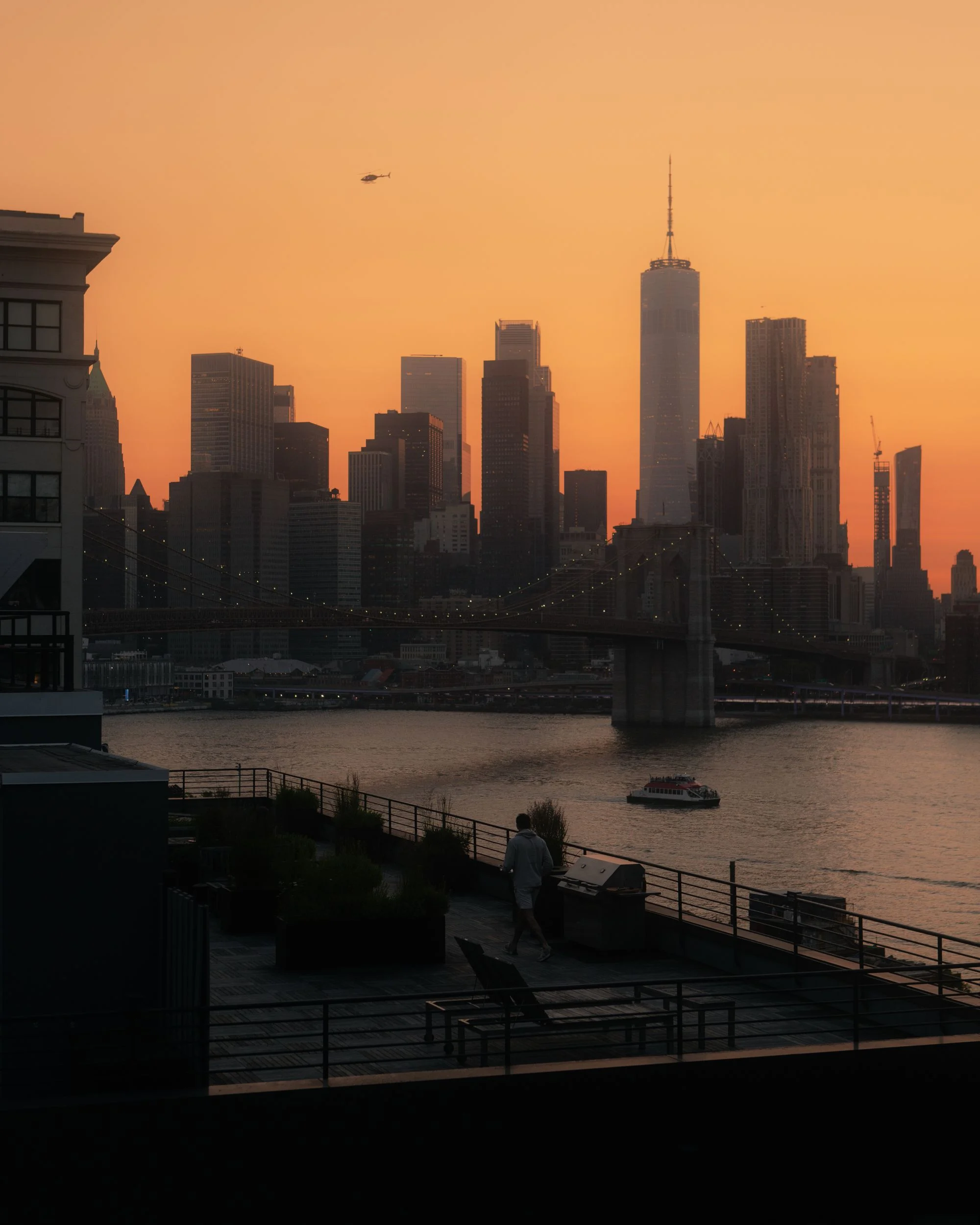 The Manhattan skyline and Brooklyn Bridge in New York at sunset