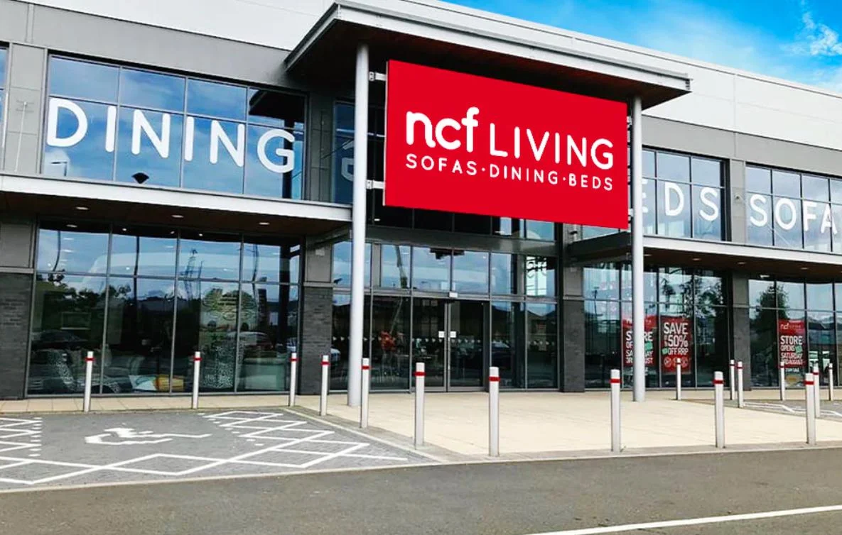 NCF Living showroom exterior with its red Sofas, Dining, Beds sign