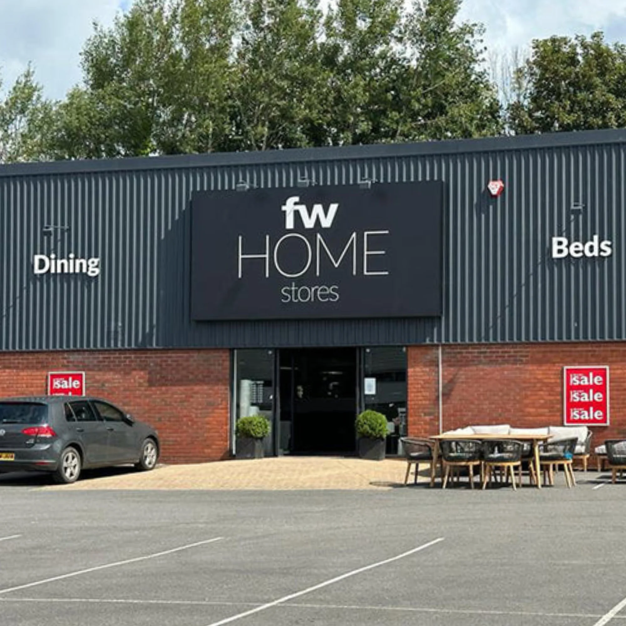 FW Home stores showroom exterior with Dining and Beds signage