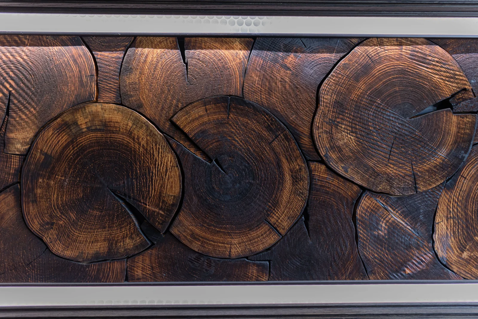 Dark wood panel detail showing the end grain