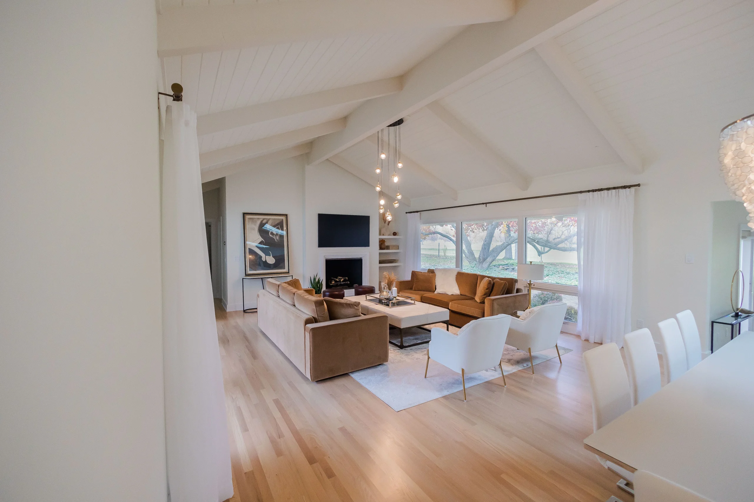 Bright vaulted great room with abundant daylight at the Brand Lane Residence